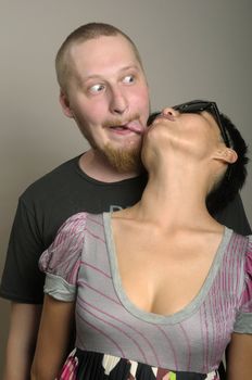 Young man touch woman with tongue