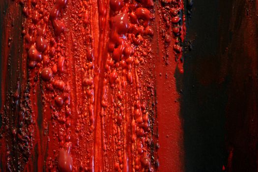 Image of blood and guts splattered against a black surface.  Background image for horror / halloween, etc.
