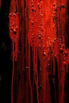 Image of blood and guts splattered against a black surface.  Background image for horror / halloween, etc.
