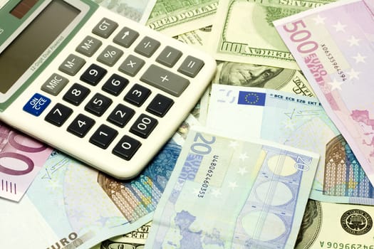 Dollar, euro banknotes and calculator