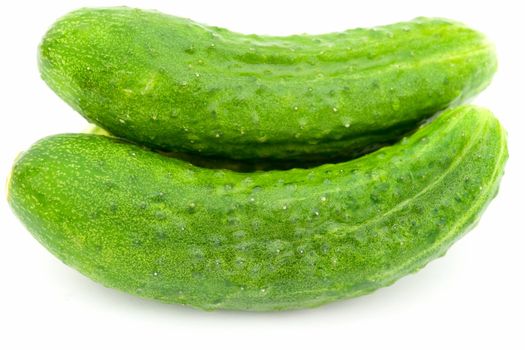 Two green cucumbers on a white background.