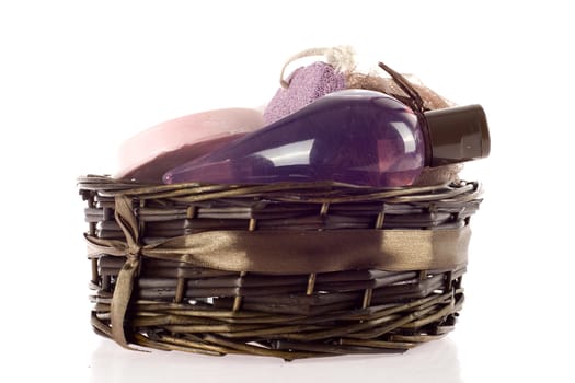 a basket with different things, like soap and a sponge