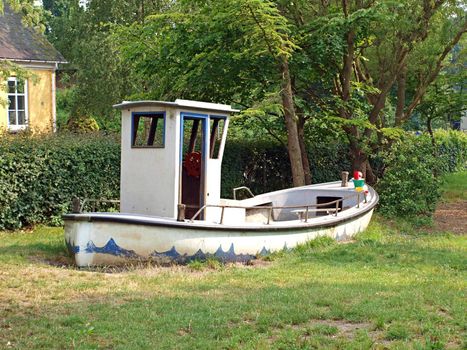 Toy boat in a playground of a kindergarten 