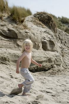 a young boy having fun on the beach