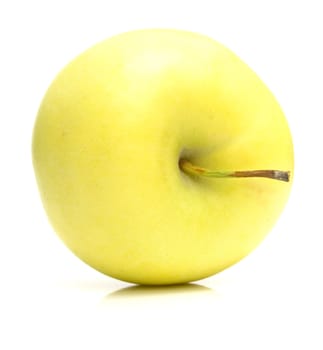 The ripe juicy yellow apple . Isolation on white, shallow DOF.
