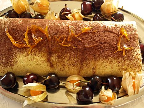 Cake with cherries chocolate and sugared oranges peel