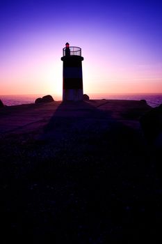 Beautiful landscape picture of a lighthouse at sunset