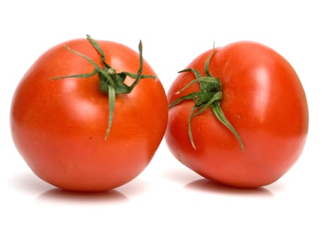 Two juicy fresh tomatoes on white. Isolation.