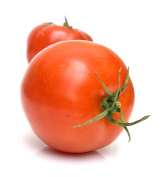 Two juicy fresh tomatoes on white. Isolation.