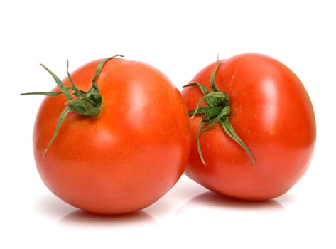 Two juicy fresh tomatoes on white. Isolation.