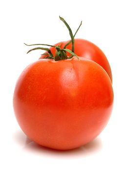 Two juicy fresh tomatoes on white. Isolation.