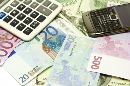 Dollar, euro banknotes, calculator, cellphone