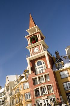 A clock tower by a beautifull sunny day