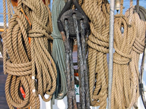 Collection of ropes on an old wooden sail boat