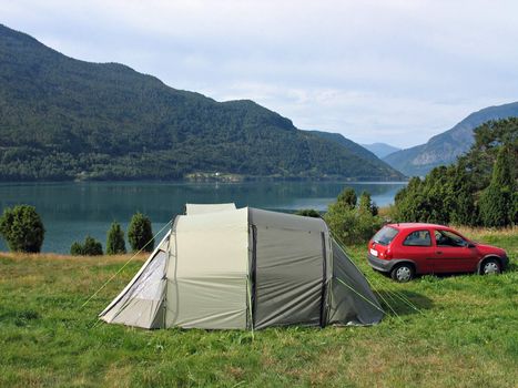 Camping in a tent in a camping site by a fjord in Norway