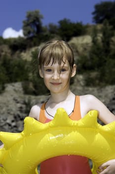 The girl bathes on lake 