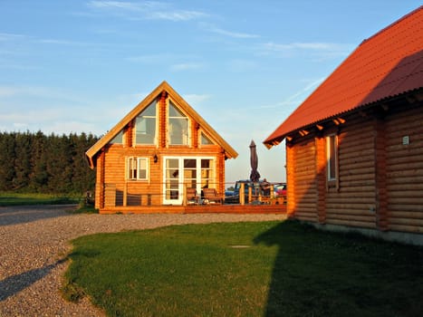 Logs summer house in the sunset Denmark