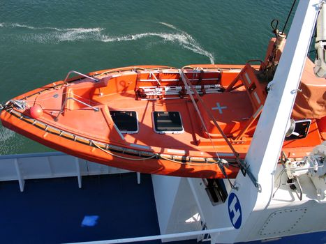 Lifeboat rescue boat on a big passenger ferry boat
