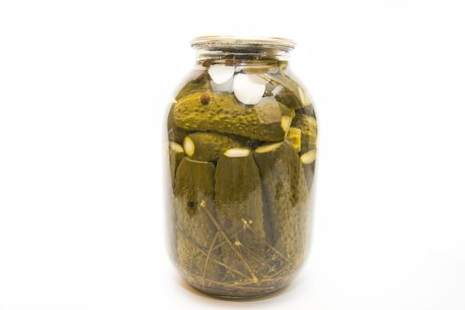 Pickles in a jar on white background