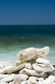 heap of limestone pebbles lying on the beach
