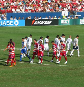 The FC Dallas Hoops and LA Galaxy soccer teams take their postion at the start of the game on July, 27, 2008 in Frisco, Texas.
