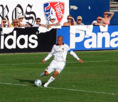 David Beckham kicks the soccer ball during a game between the LA Galaxy and FC Dallas on July 27. 2008 in Frisco, Texas
