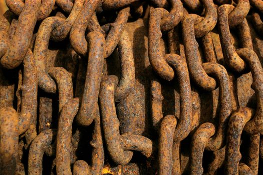 Background image of a rusty pile of chain. 
