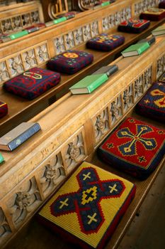 Cushioned pews from a church in England. (Focus is in the middle)
