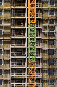 Large building under construction with scaffold