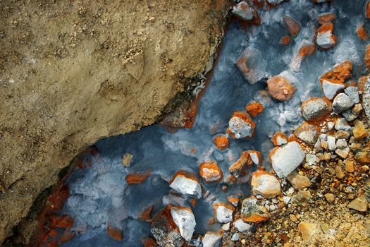 Amazing colors in a geothermal creek in Iceland - The colors come from minerals in the boiling hot water