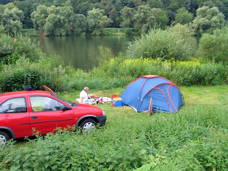 Camping in a tent by the river Mosel Germany