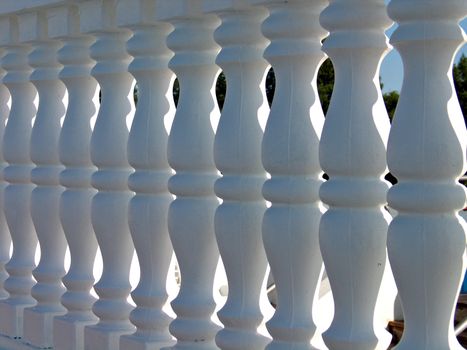 Decorative white stone fence - abstract play of lights and shadows
