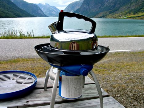 Kettle on a gas stove in camping in the Fjords area of Norway