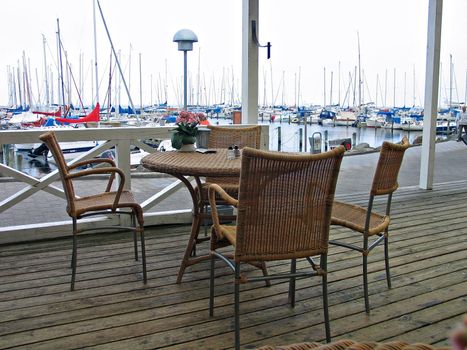 Coffee table in a coffee shop in a marina ready to be served