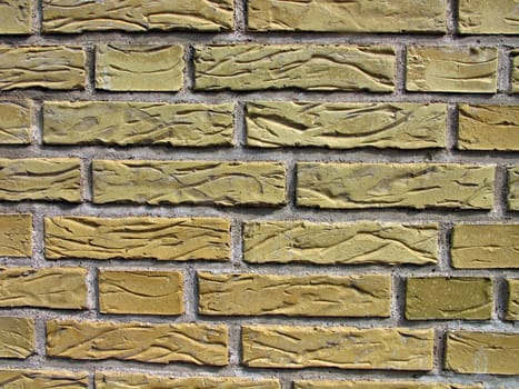 Details of a wall made with carved yellow bricks