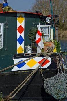 The cross of Saint George adorns this houseboat moored on the Gloucester and Sharpness canal