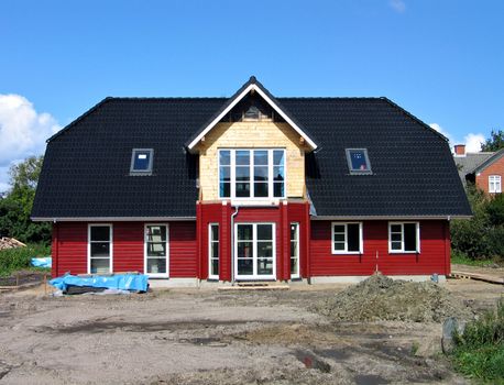 Modern wooden home in the construction process