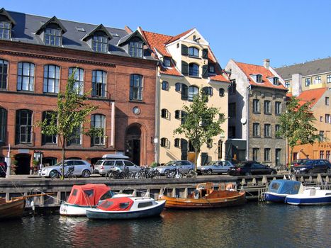 Copenhagen - houses and boats in the water front of the canals