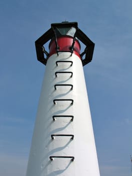 Details of a small lighthouse in a port