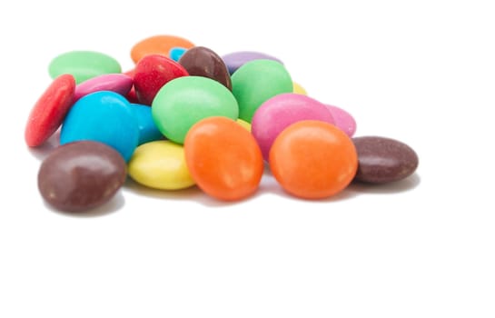 coloured smarties  over a light background
