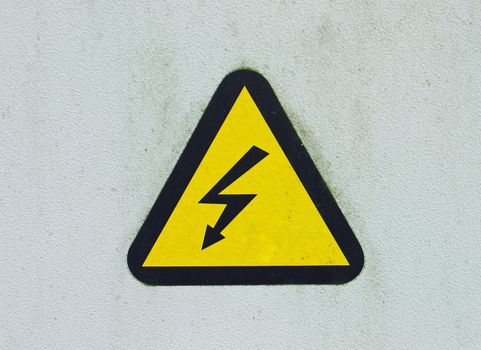High voltage warning sign mounted on a wall