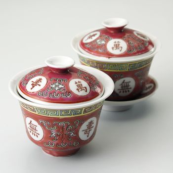 traditional chinese tea cups on the plain background
