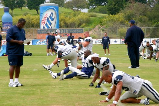 The Dallas Cowboys at their 2008 summer training camp in Oxnard, CA during a training session working out.