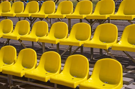 Lines of yellow seats.