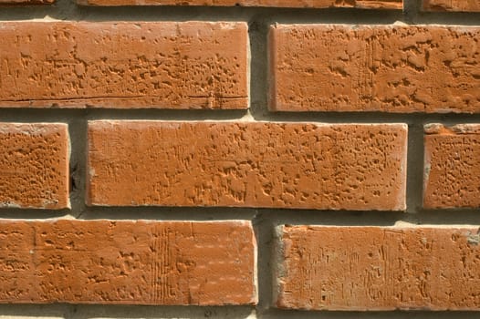 Wall  laid out by red bricks.