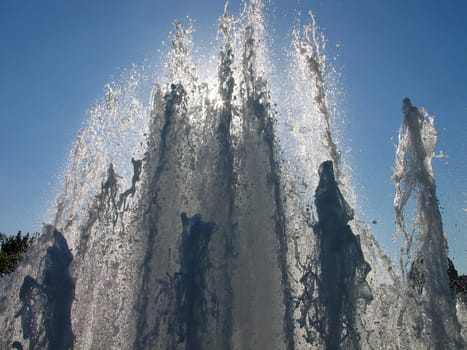 Water fountain with sun backlight in Copenhagen Denmark