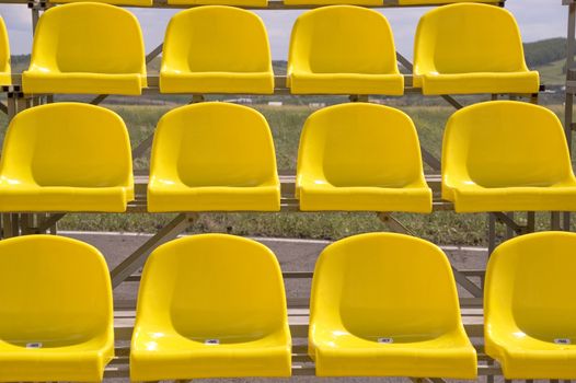 Lines of yellow seats.