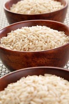 Several bowls of healthy organic basmati rice.