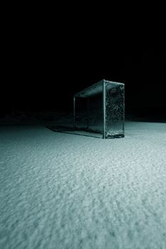 NIghtscene of a deserted soccerfield after a blizzard