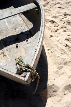 Old row boat on a beach.